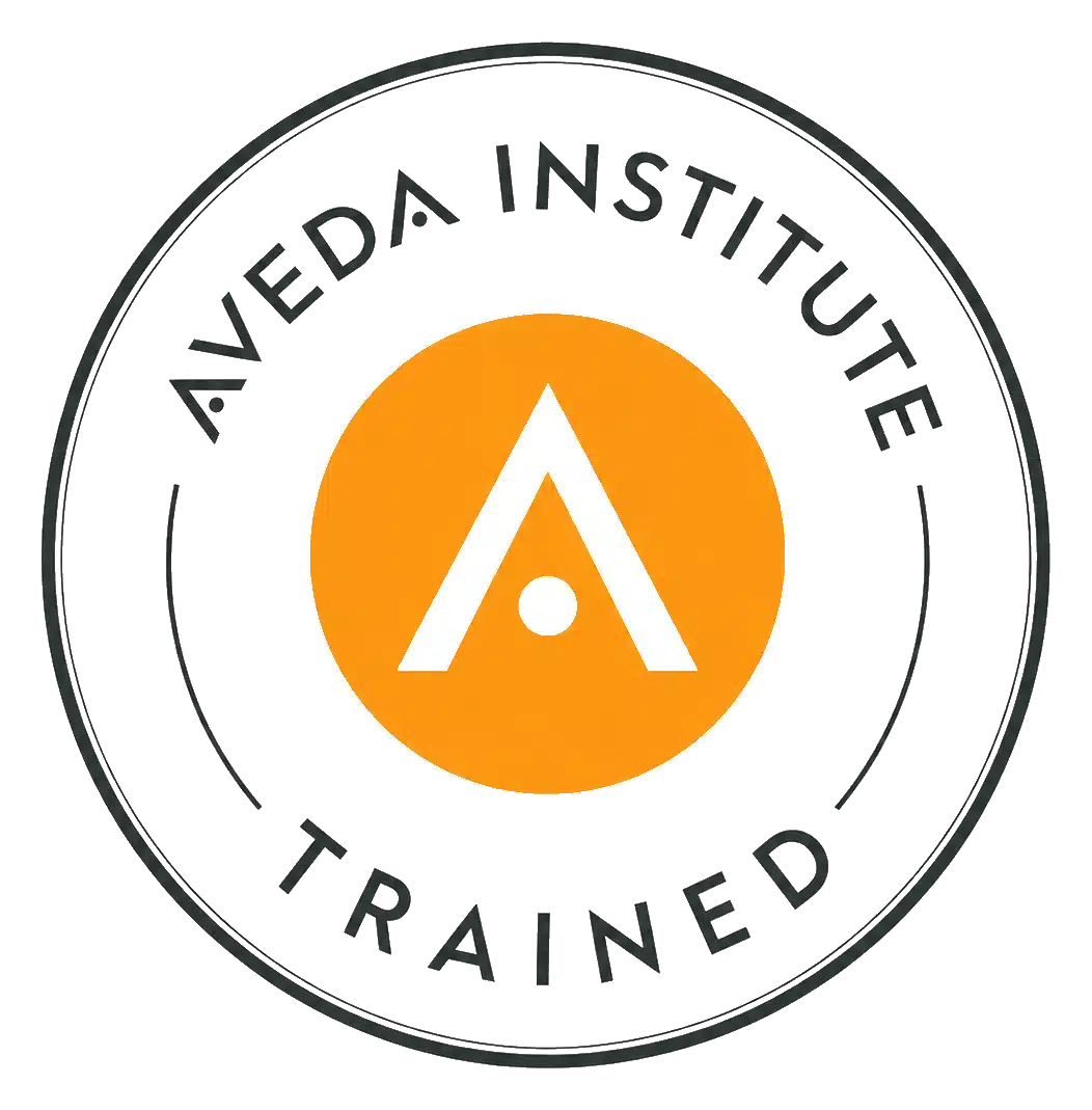 Aveda Institute trained badge for Sarah Sheeti, master aesthetician serving Portland OR and Vancouver WA
