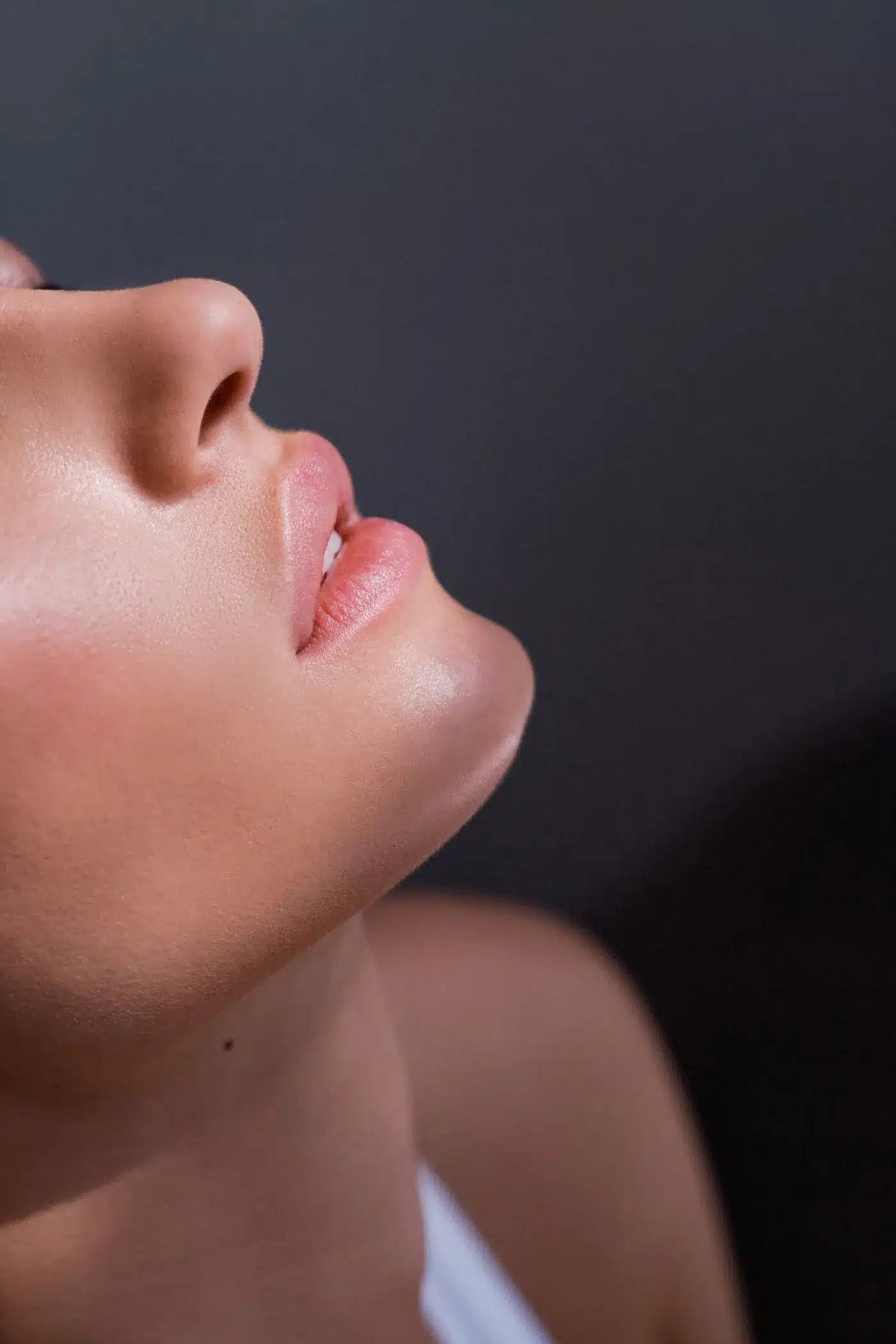 Woman looking upward, showing a defined jaw and neckline, Kybella in Portland, Oregon